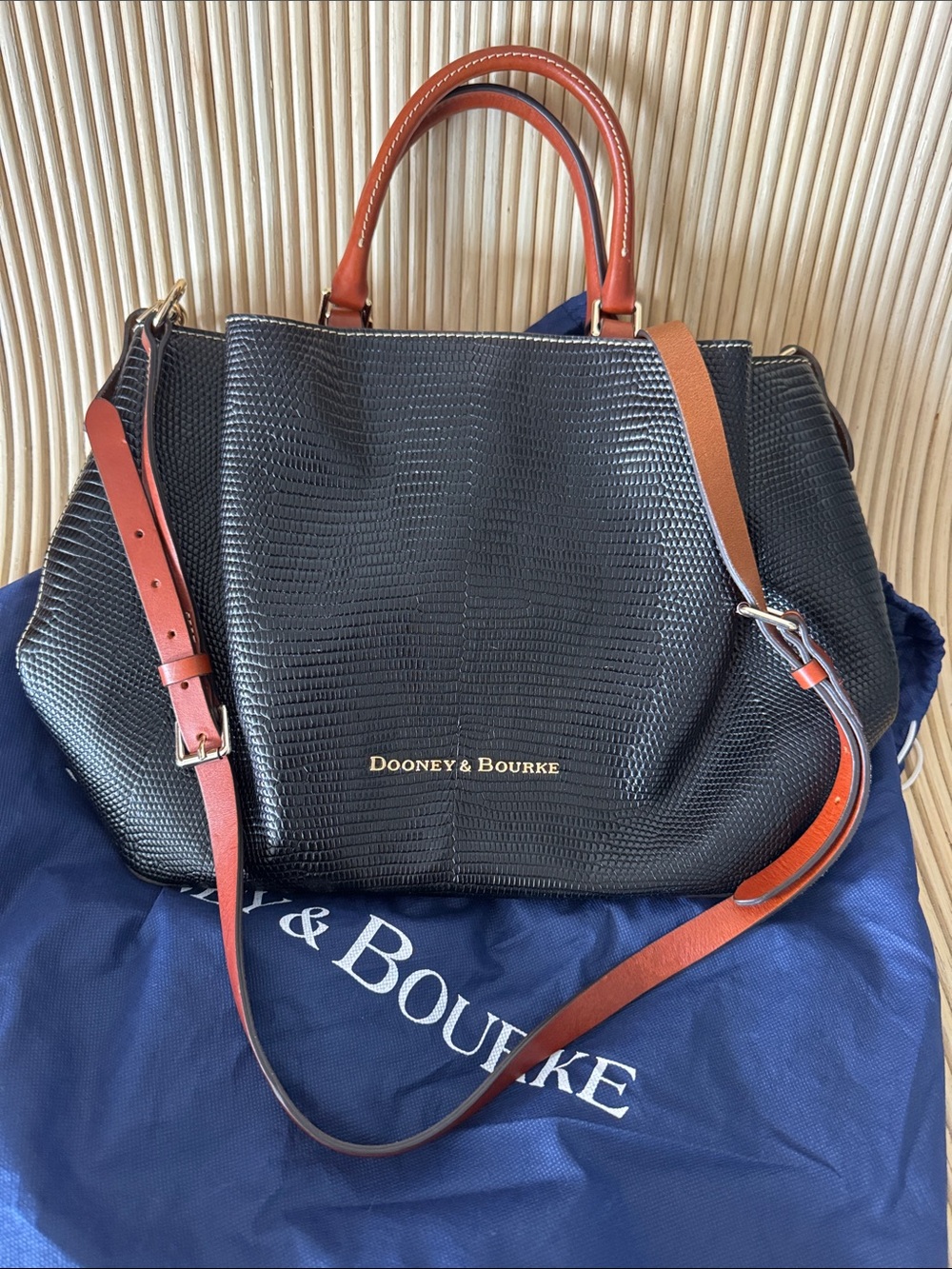 Dooney & Bourke Black Textured Satchel with Brown Leather Straps and Gold Logo